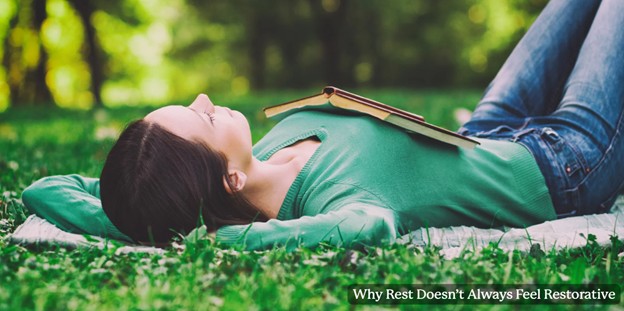 Woman relaxing with a book outdoors